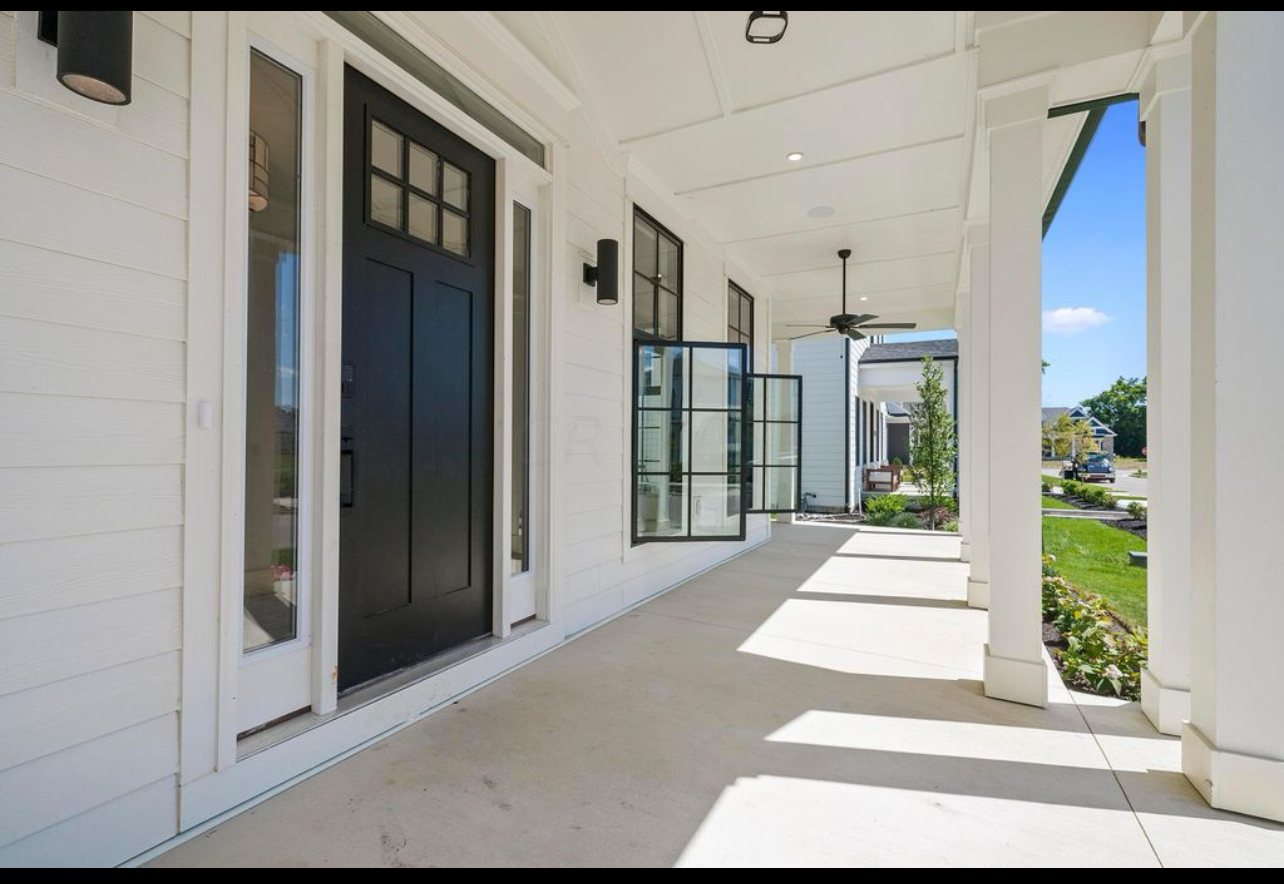 Welcoming front porch by Three A Homes