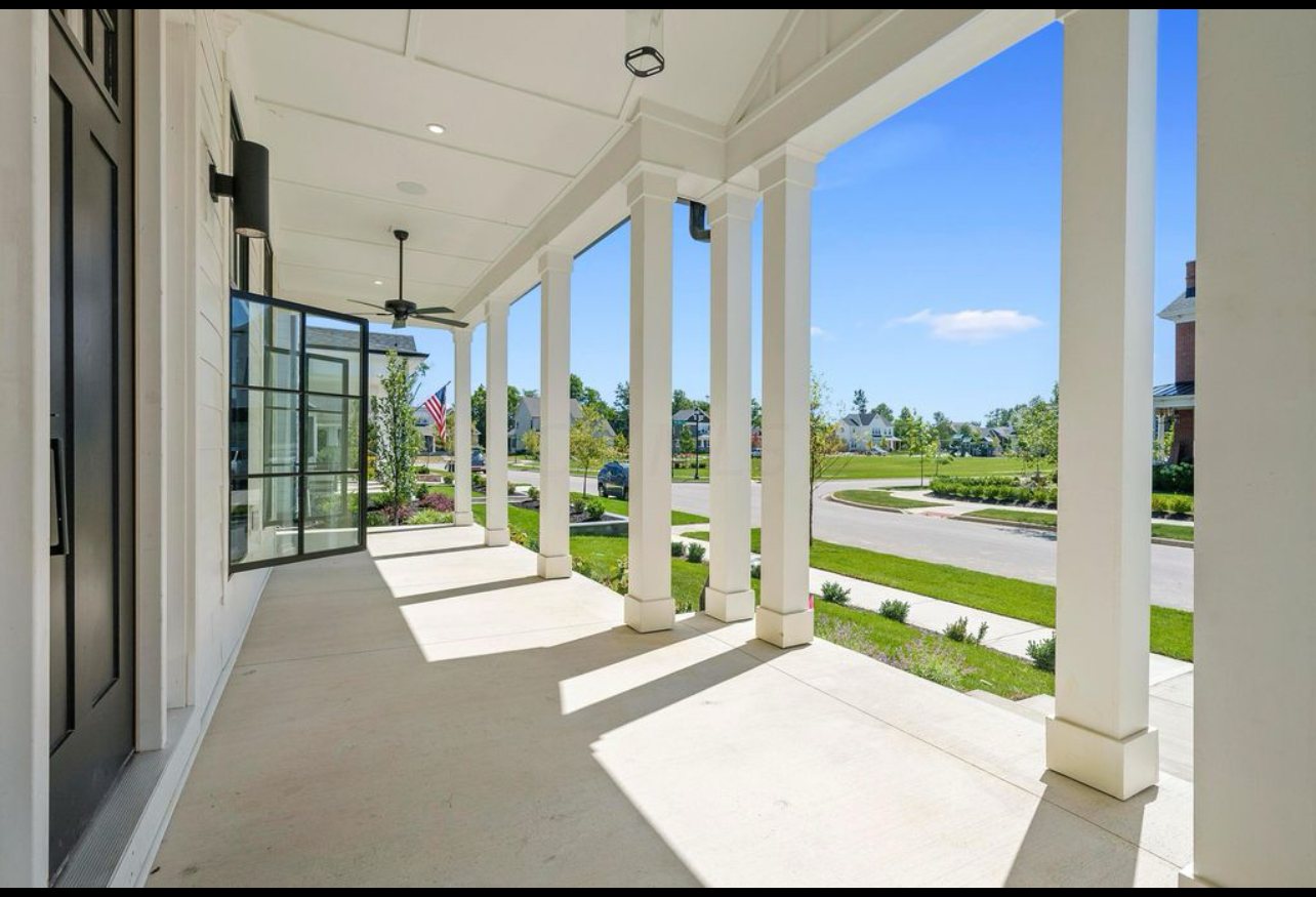 Wraparound porch view by Three A Homes